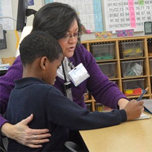 Vicki Boase helps comfort an unhappy student